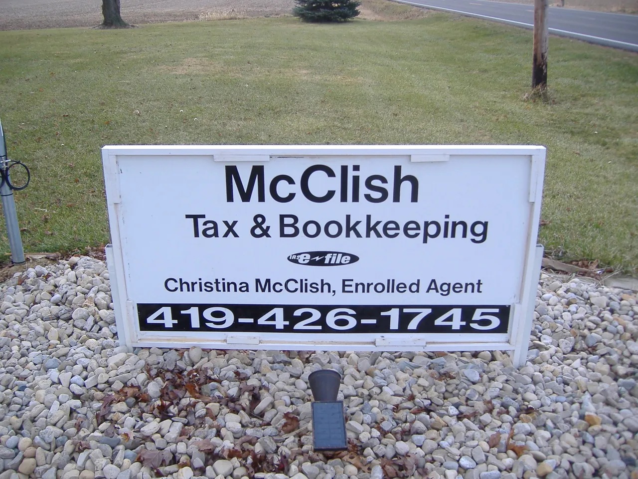McCLish Tax & Bookkeeping sign with business name and telephone number